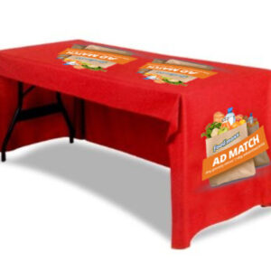 A table with a red printed cover of a brand